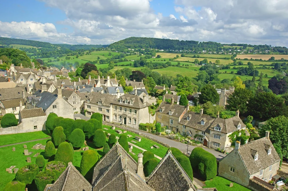 A Cotswold hilltop village of honey-coloured stone cottages overlooking the Gloucestershire countryside